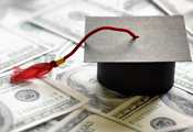 Graduation cap placed on money