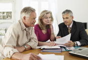 Couple meeting with financial adviser