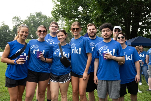 volleyball25-DSC02466 Team of men and women in matching t-shirts, many holding cups