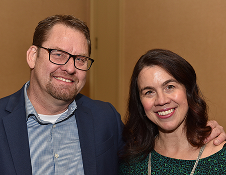Two smiling PICPA members at an event