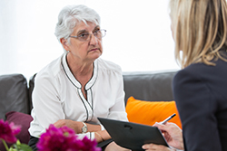 Elderly woman being counseled 