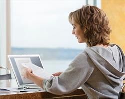 Woman at laptop doing a job search