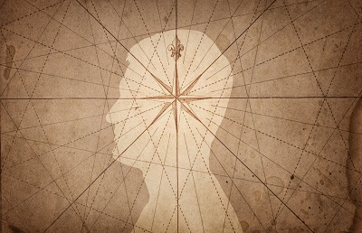 Map compass over the silhouette of a head