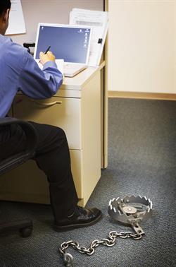 Officework trap Office worker unaware of trap set next to his desk