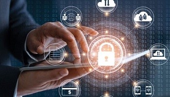 Businessman on tablet reviewing what business processes are locked and secure.