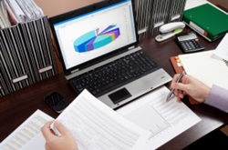 asc-842-lease-accounting-wont-be-as-hard-as-you-think CPA reviewing documents to implement new ASC 842 lease accounting standards