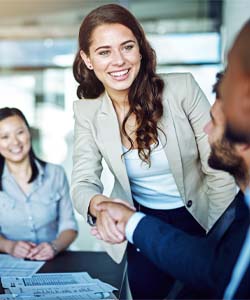 Young manager taking initiative to meet everyone in conference room