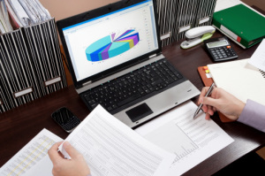 CPA reviewing documents to ensure new ASC 842 lease accounting steps don't affect debt covenants