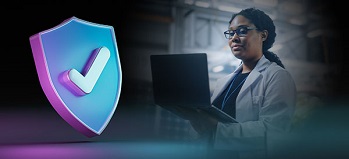 Security Shield graphic in front of CPA working on laptop