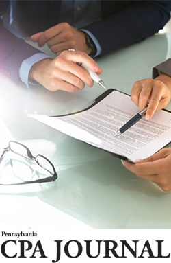 Two people reading a document
