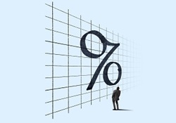 Small man looking up at very large percent symbol on grided wall