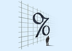 interest-rates-rise-find-out-what-the-fed-thinks Small man looking up at very large percent symbol on grided wall