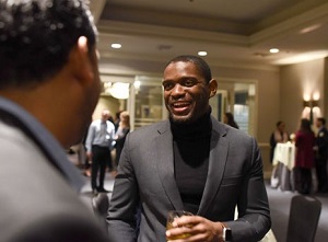 Two professionals chatting at relaxed networking event