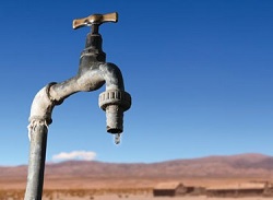 Nearly tapped out water faucet in desert