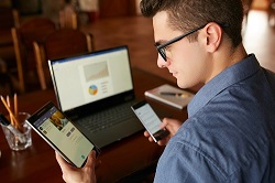 Tax client looking at messages on multiple devices.