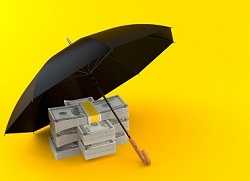 Stack of cash under an umbrella.