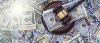 Gavel surrounded by cash