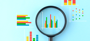 Magnifying glass set over one performance graph on a sheet of several graphs.