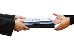CPA handing workpapers back to a client
